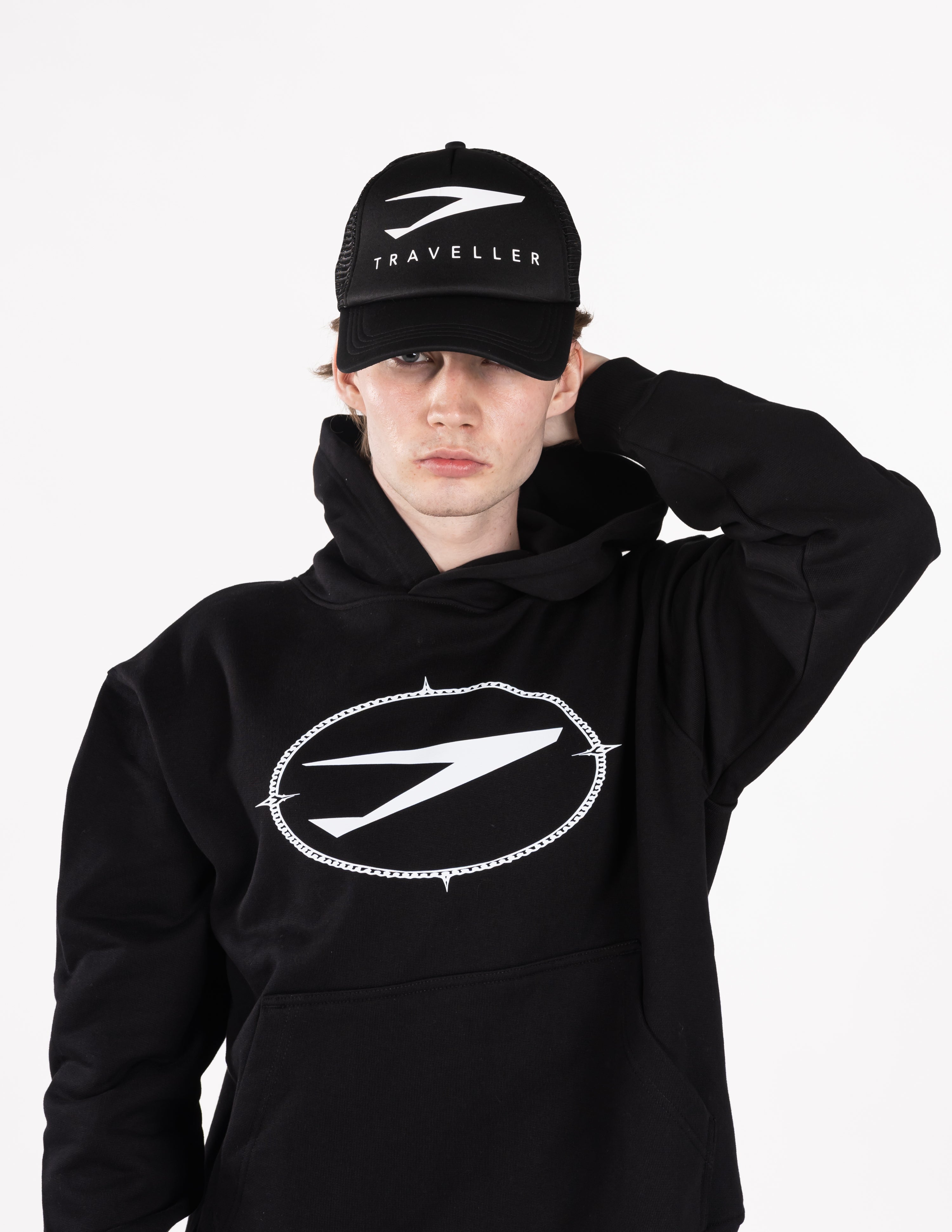 Traveller First Class Trucker hat Black text logo